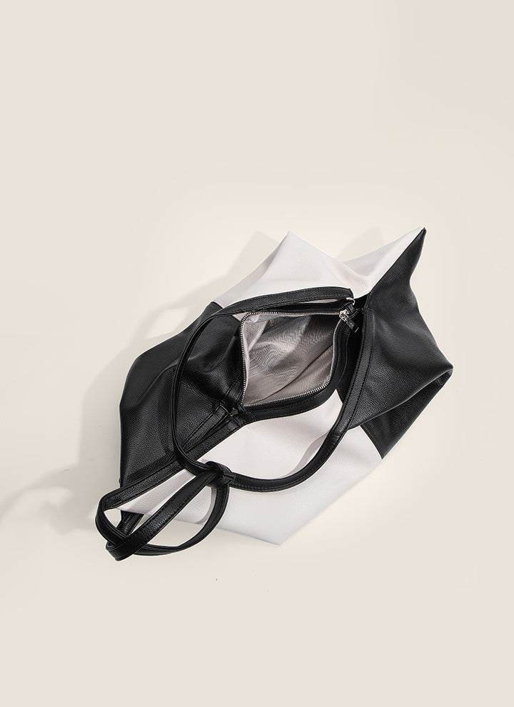 ISOLE公式｜柔らかなレザーの魅力を引き立てるブラックバイカラーバッグ